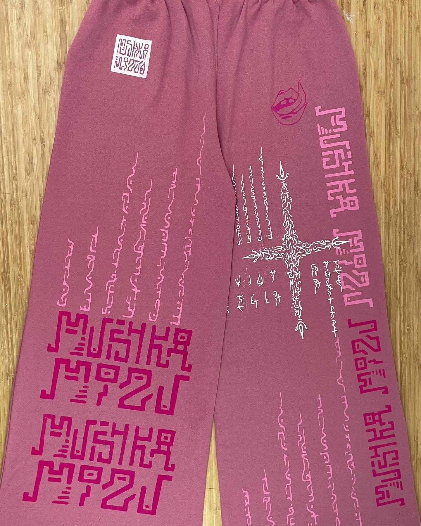 PINK MADNESS Alien Contact Hand printed wide leg tracksuit bottoms/ joggers. (Gender Neutral. Pink)