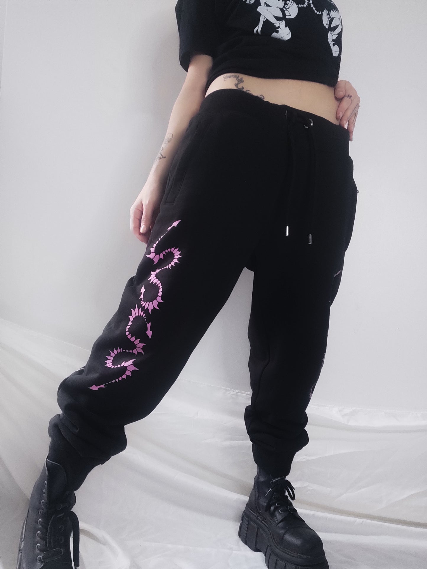 Hand printed Creature organic cotton tracksuit bottoms. Pink