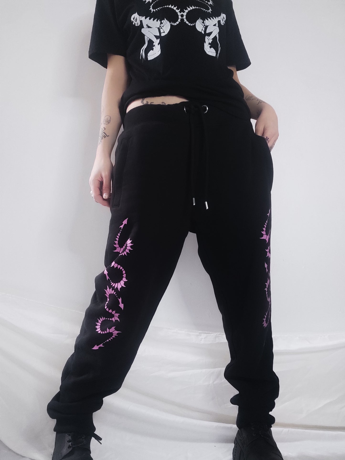 Hand printed Creature organic cotton tracksuit bottoms. Pink