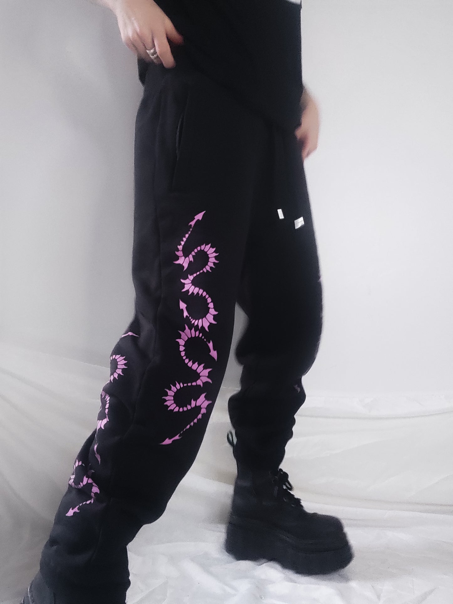 Hand printed Creature organic cotton tracksuit bottoms. Pink