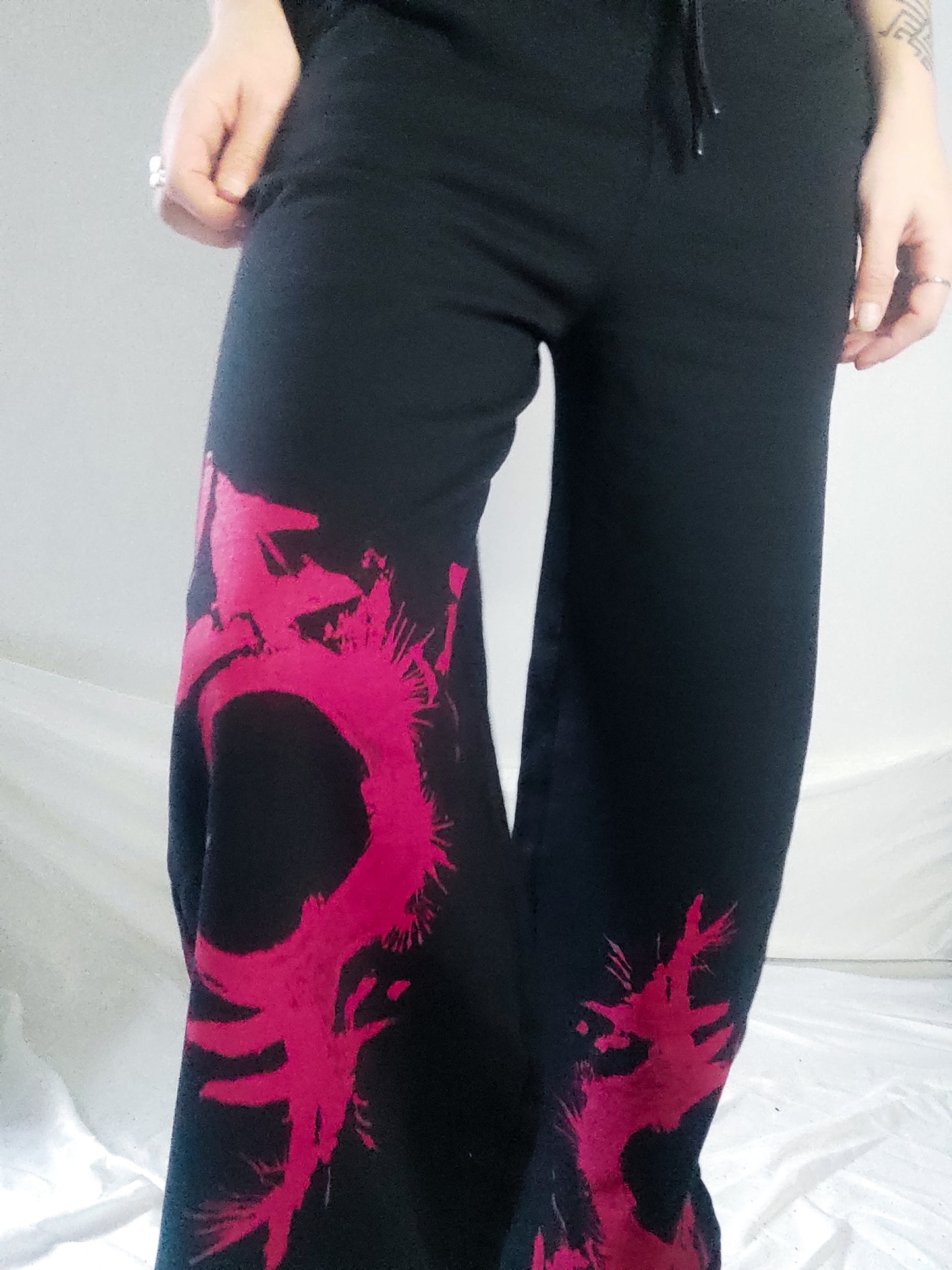 Gender F*ck hand printed wide leg tracksuit bottoms/Joggers. Red