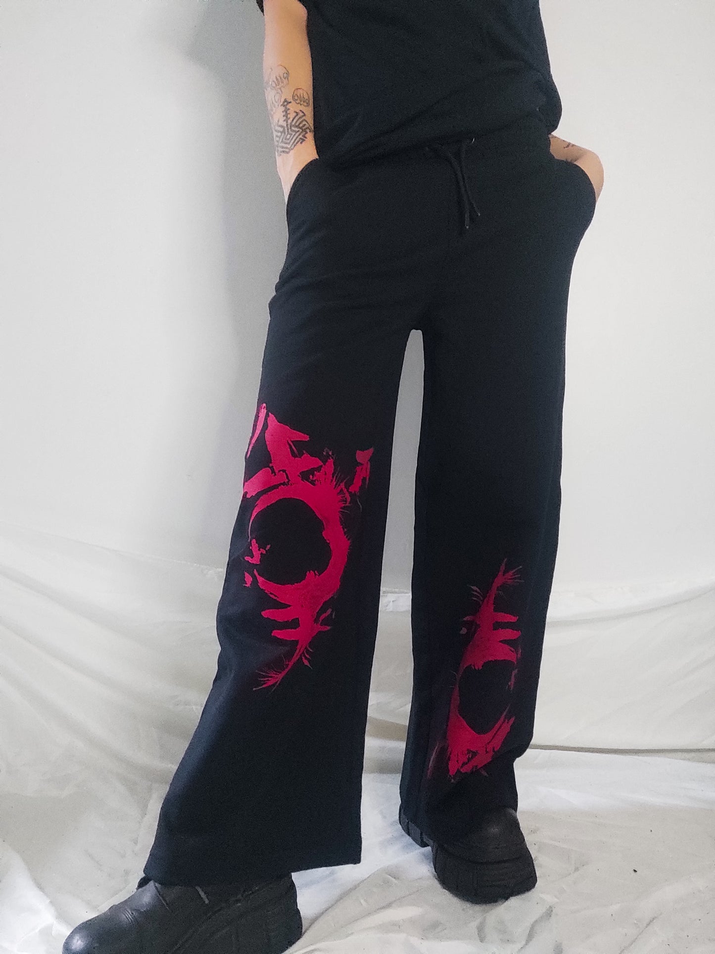 Gender F*ck hand printed wide leg tracksuit bottoms/Joggers. Red