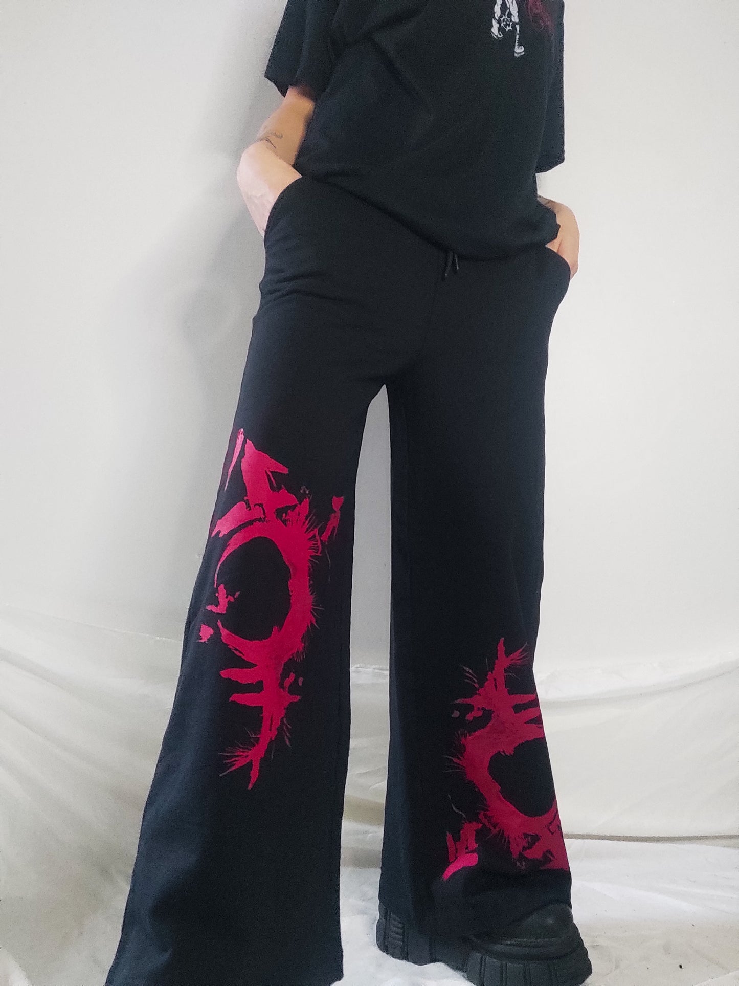 Gender F*ck hand printed wide leg tracksuit bottoms/Joggers. Red