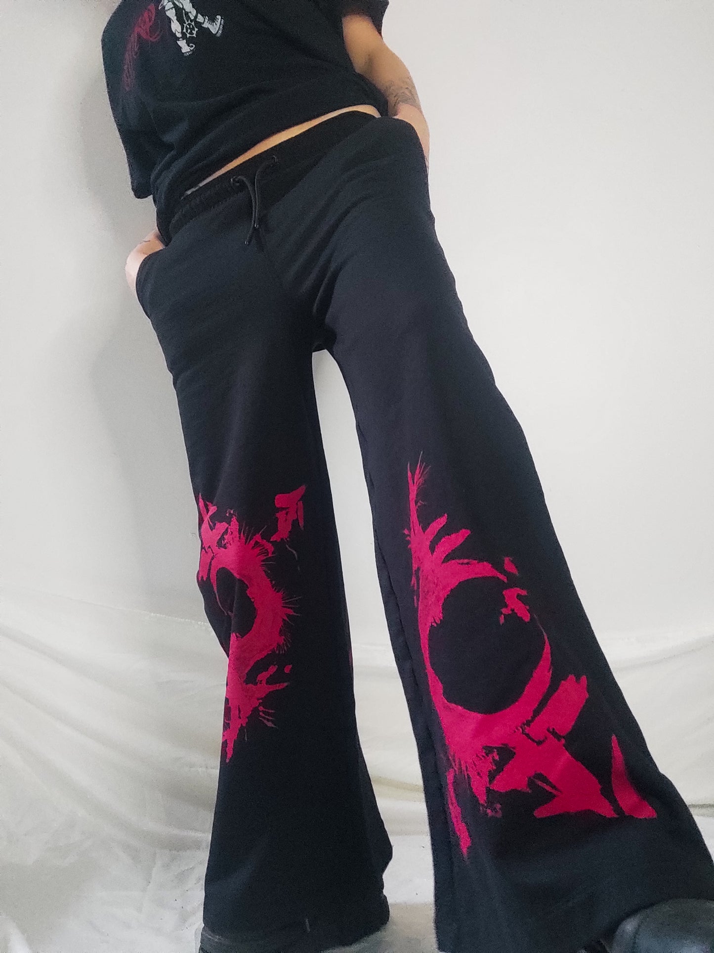 Gender F*ck hand printed wide leg tracksuit bottoms/Joggers. Red