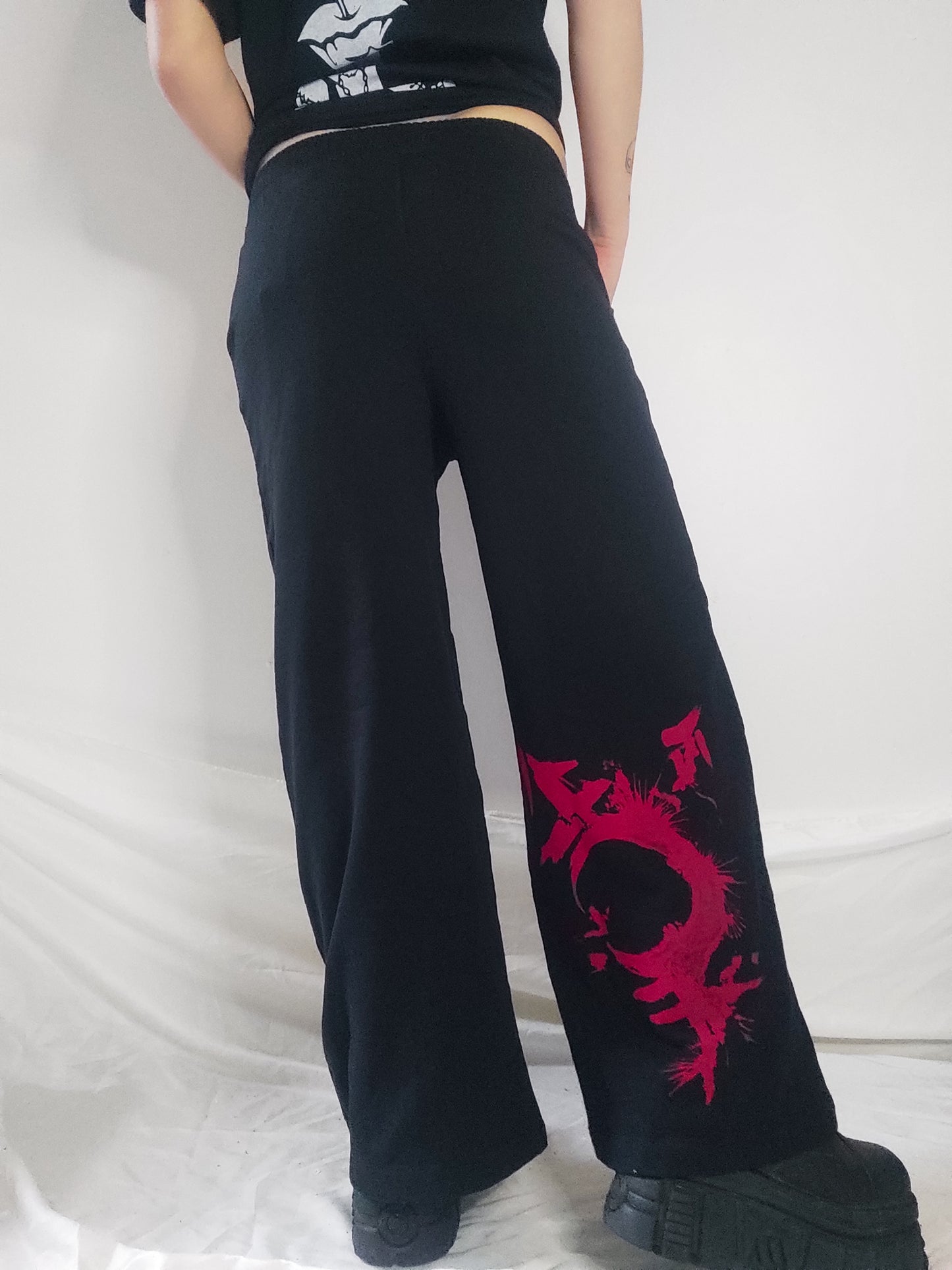 Gender F*ck hand printed wide leg tracksuit bottoms/Joggers. Red