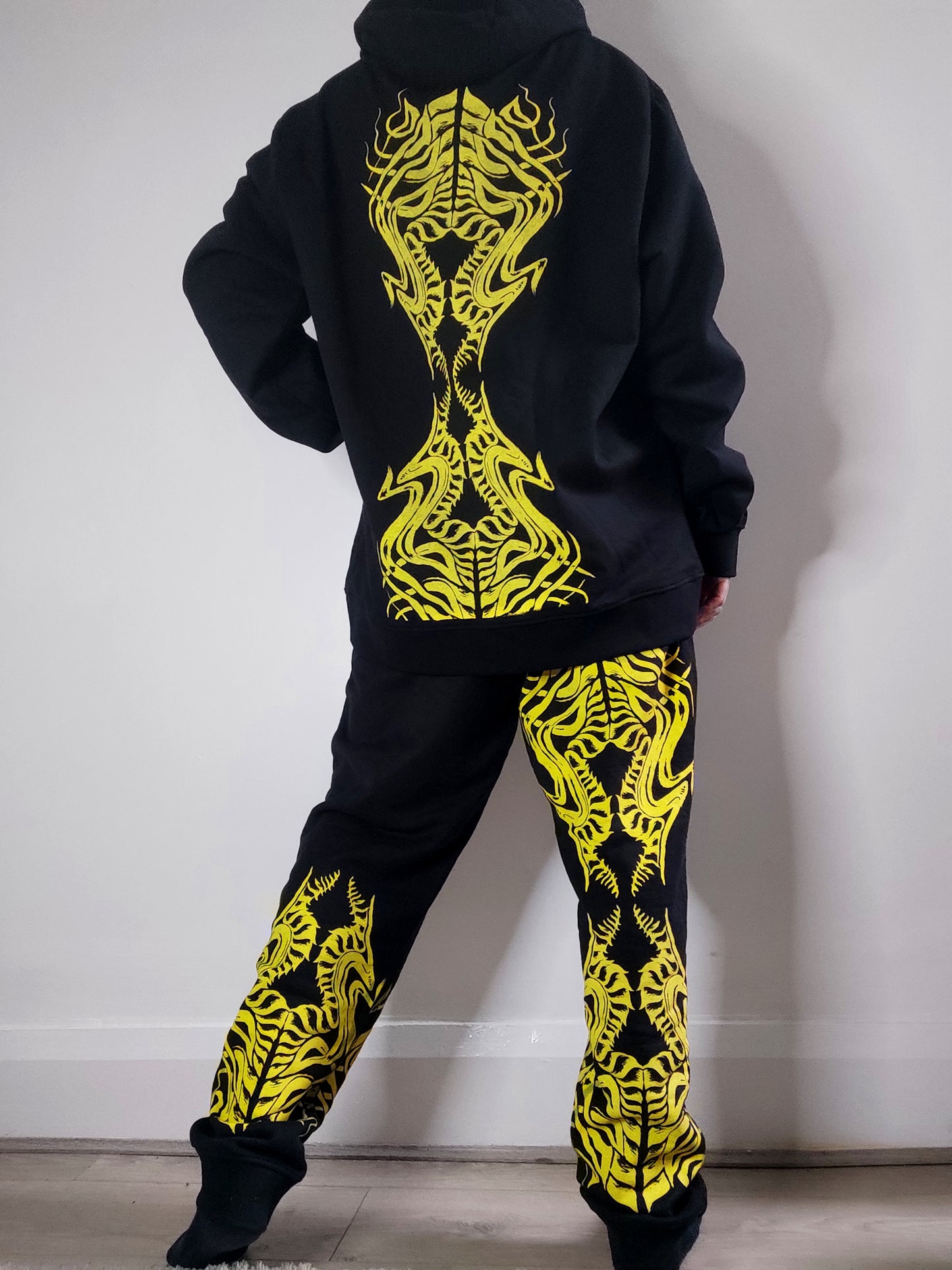 Biomechanika Full hand printed organic cotton gender neutral tracksuit. Black and Yellow