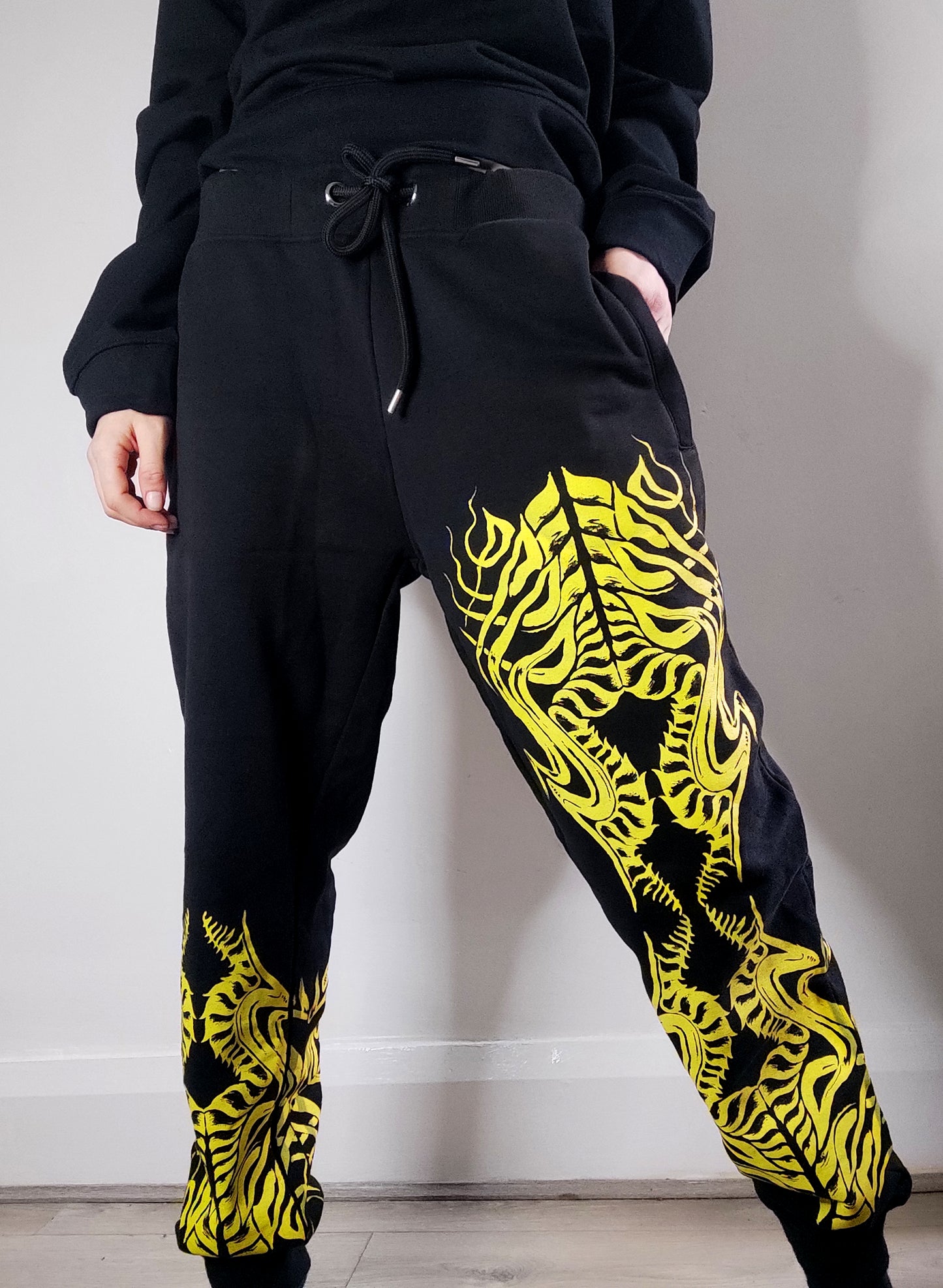 Biomechanika Hand printed gender neutral organic cotton tracksuit bottoms/Joggers. Black and Yellow