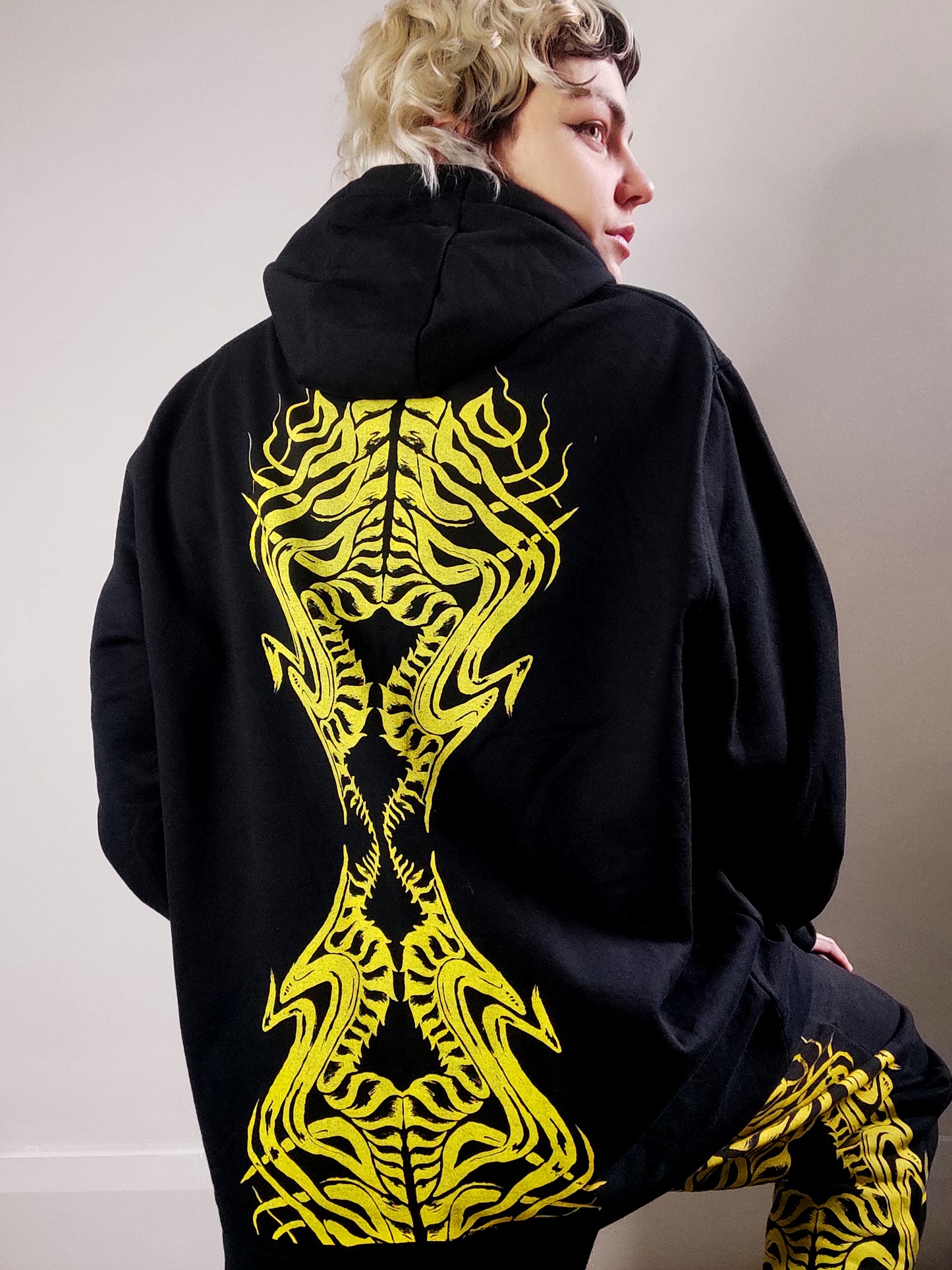 Biomechanika Full hand printed organic cotton gender neutral tracksuit. Black and Yellow