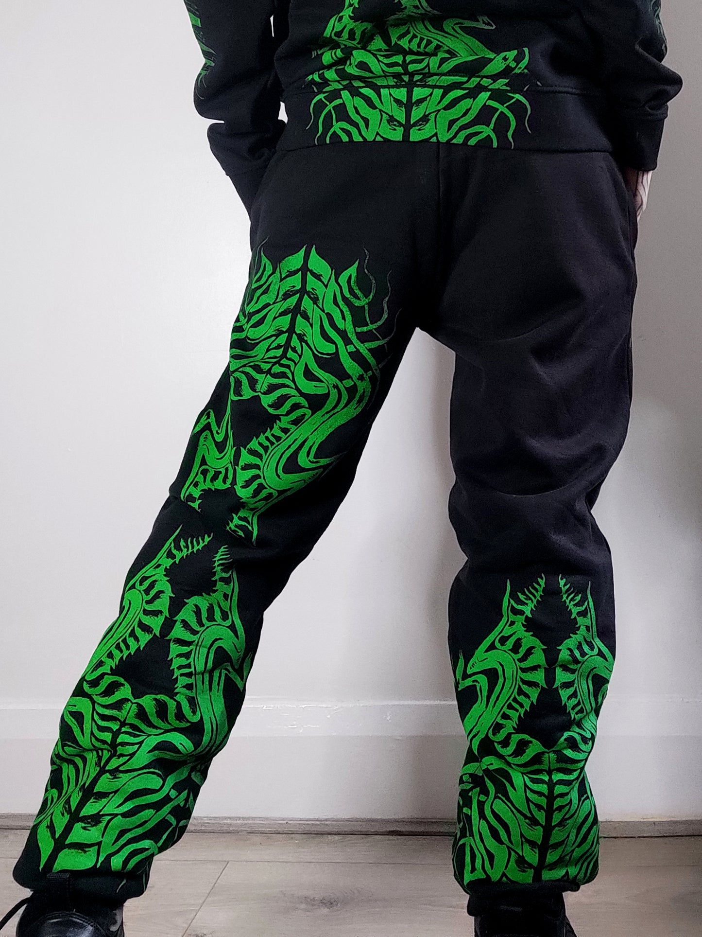 Biomechanika Hand printed gender neutral organic cotton tracksuit bottoms/Joggers. Black and Green