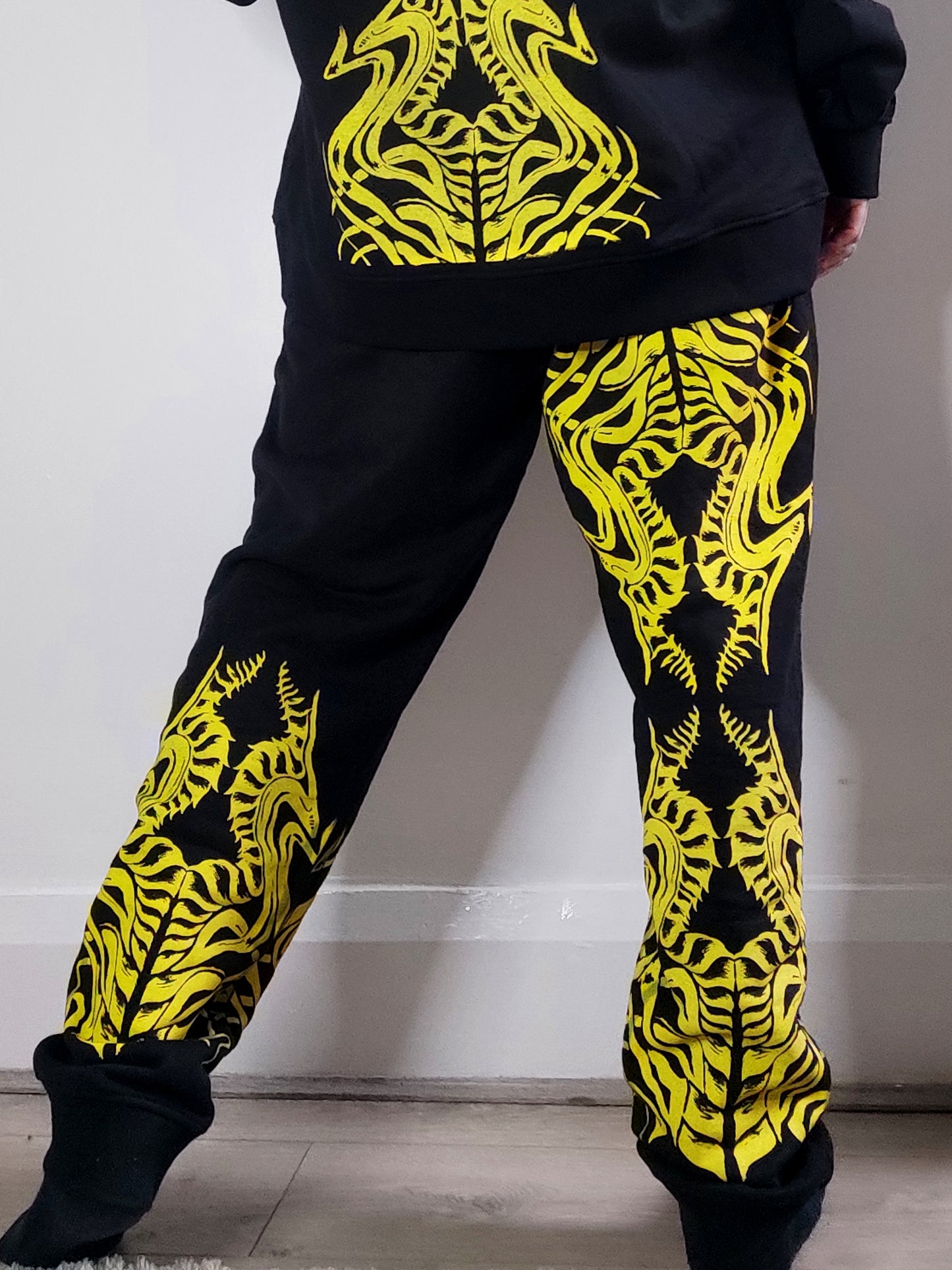 Biomechanika Hand printed gender neutral organic cotton tracksuit bottoms/Joggers. Black and Yellow